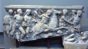 1280px-Fragments_of_a_marble_sarcophagus_depicting_the_Caledonian_boar-hunt_8728890988-1024x576